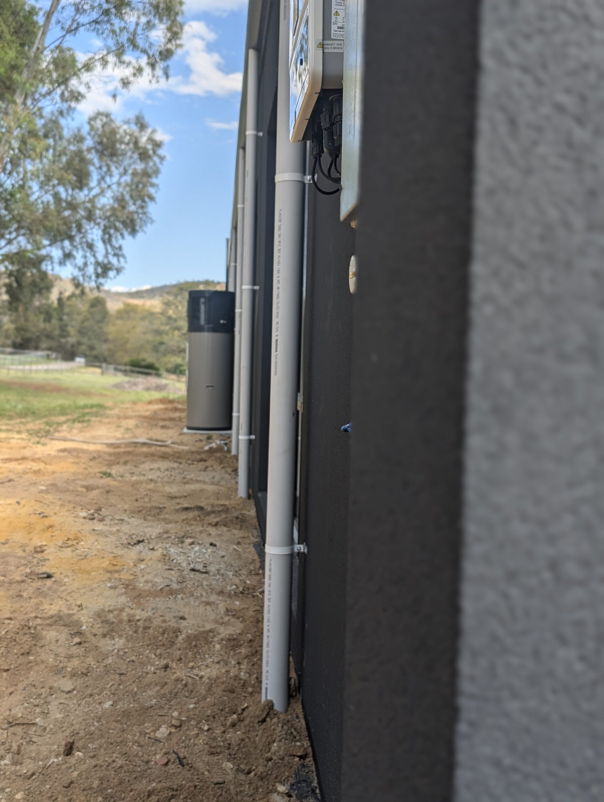 Rainwater/Stormwater downpipes on side of new build semi-rural property.